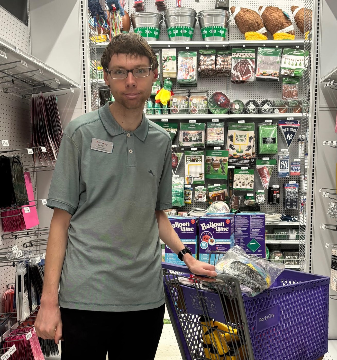 David shown working at his job at Party City