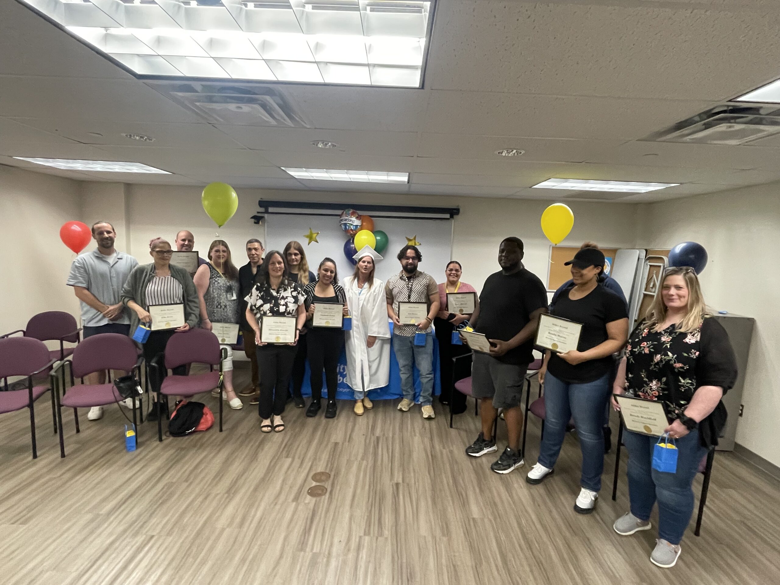 Pathways program graduates stand for a group photo